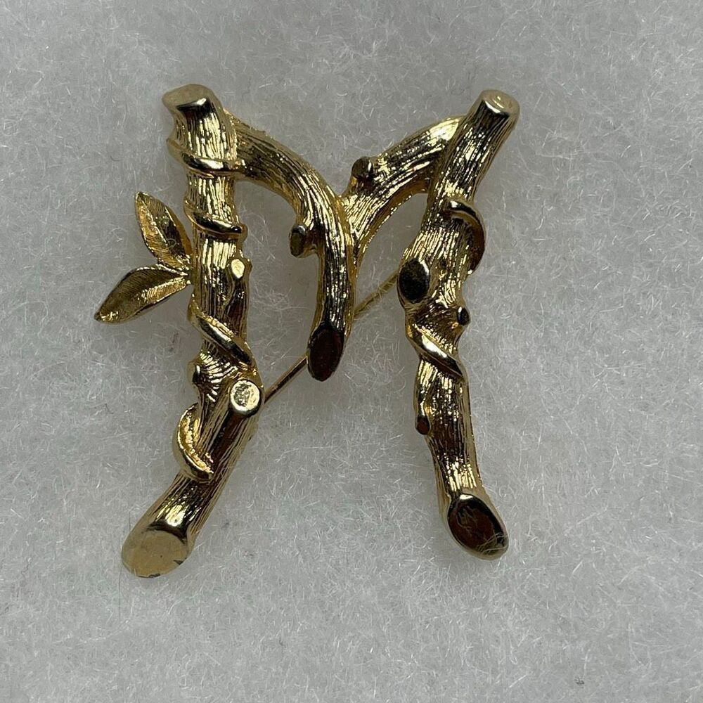 Sarah Coventry initial “ M” bamboo design gold tone.